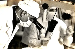 Dr. P. Siva Reddy at an early operating microscope
